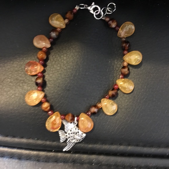 Orange and brown beaded bracelet with fish charm - Picture 2 of 2